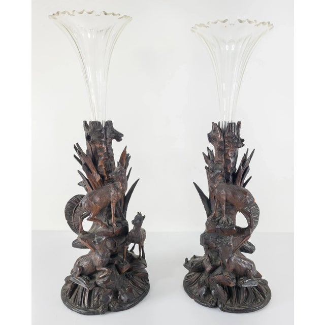 We are selling this pair of Black Forest carved vases with glass inserts. This matching pair of Austrian or German carved...
