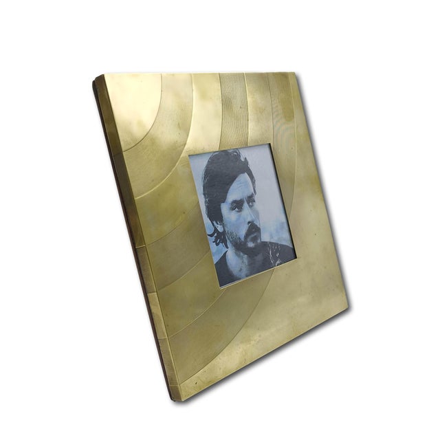 Delightful square table frame made entirely of brass from the 1970s. The decoration consists of curved lines and...