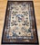 This vintage Chinese Art Deco area rug is a beautifully woven tapestry of symbolism, elegance, and cultural heritage....
