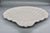 A classic white glazed scallop shell dish from Spode's Imperial line, made in England. The fluted, radiating shell design...