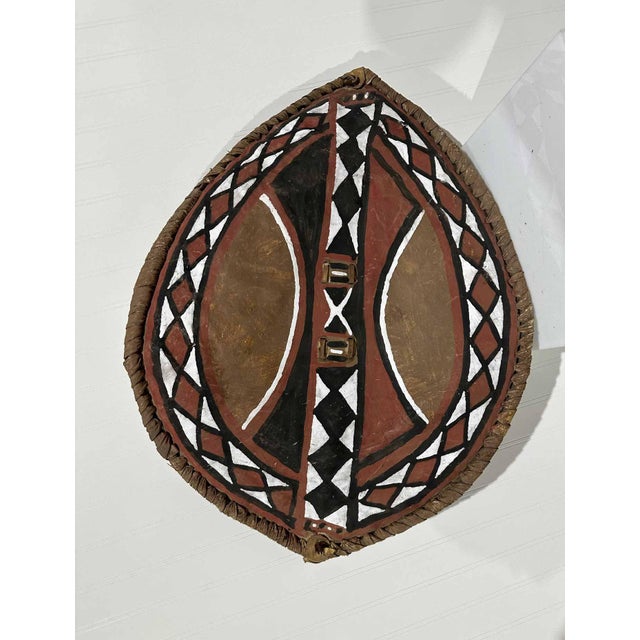 Maasai Shield hand painted with pigments on hide. This stunning elliptical graphic shield was probably owned by a warrior...