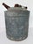 Bring industrial charm and authentic age to your décor with this early 20th-century galvanized metal oil can, featuring...
