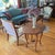 Table features four deeply curved, S-shaped cabriole legs detailed with carved acanthus leaf motifs running down the...