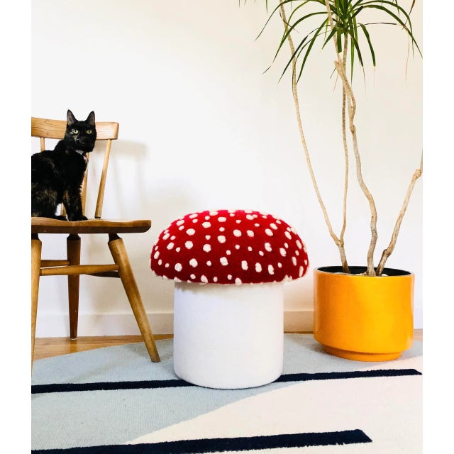 A handmade mushroom shaped ottoman, upholstered in a dotted wool blend fabric to resemble a fly agaric mushroom. Perfect...