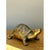 This vintage burnished brass turtle brings a warm, sculptural note to a shelf, console, or tabletop. Its shell is marked...