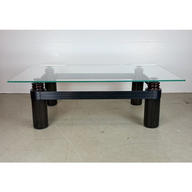 A striking sculptural coffee table by Kaiser/Newman that blends industrial elements with refined materials. The...