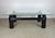 A striking sculptural coffee table by Kaiser/Newman that blends industrial elements with refined materials. The...