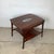 This is the kind of piece that stops you — a fully labeled John Stuart Inc. walnut two-tier end table with an...