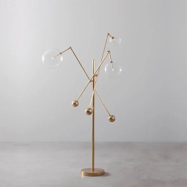 Polished nickel 3 arm floor lamp by schwung dimensions: d 124.1 x w 129.3 x h 182.6 cm materials: solid brass, hand-blown...