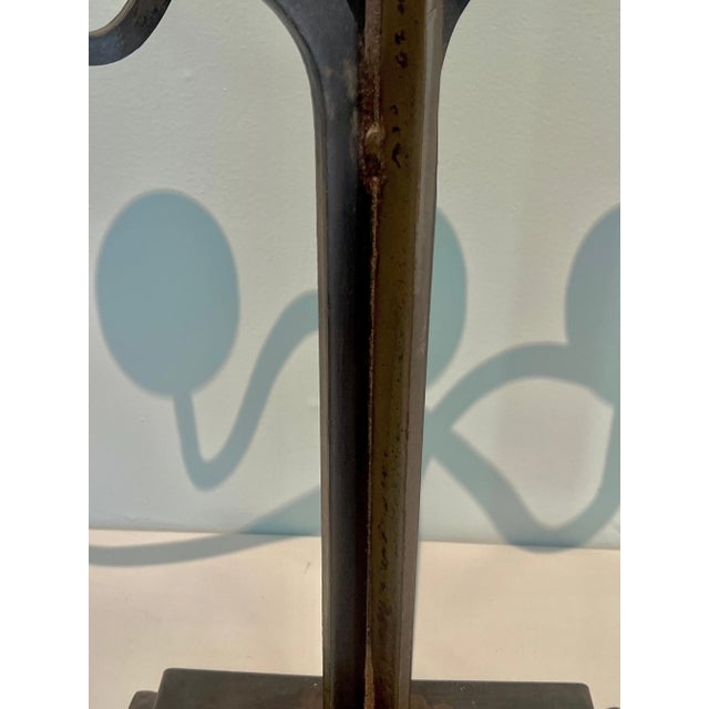 A beautifully designed, and very large, Pair of Brutalist Wrought Iron Candelabras The unique and architectural pieces...