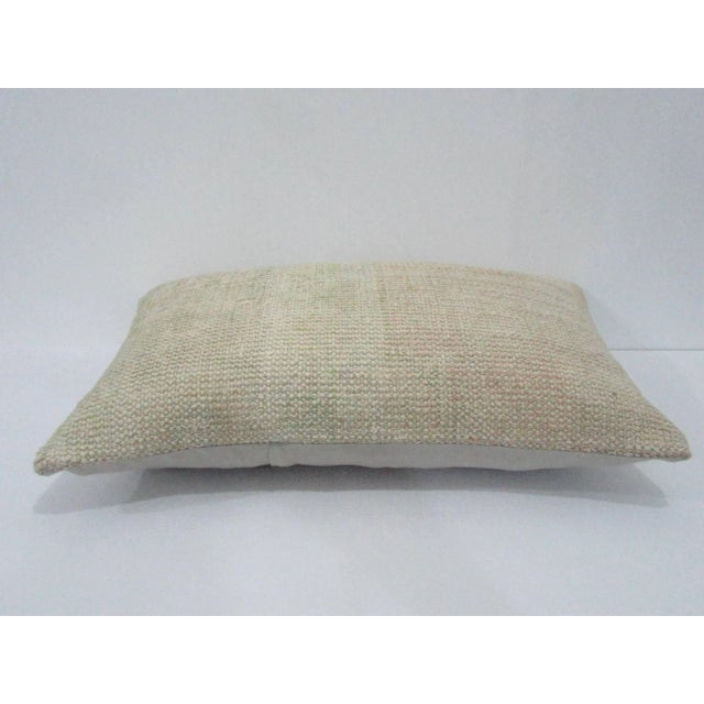 Decorative pillow cover made from a vintage Turkish handknotted rug. Backed with good quality cotton fabric. Pillow...