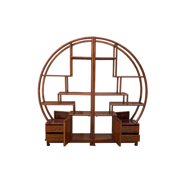 This is an oriental-style display cabinet in a round shape combined with two pieces. It can be used against the wall or as...