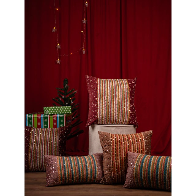 "Add warmth and charm to your living space with this earthy brown cushion, featuring intricate golden embroidery and...