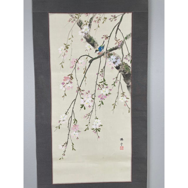 Traditional Japanese kakejiku (hanging scroll) hand-painted on silk depicting a songbird perched among cherry blossoms....