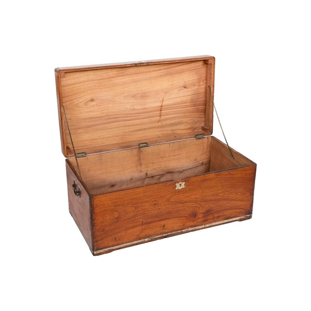 This English camphor wood chest was hand-crafted in the 19th Century. The wood has aged beautifully over the years, with...