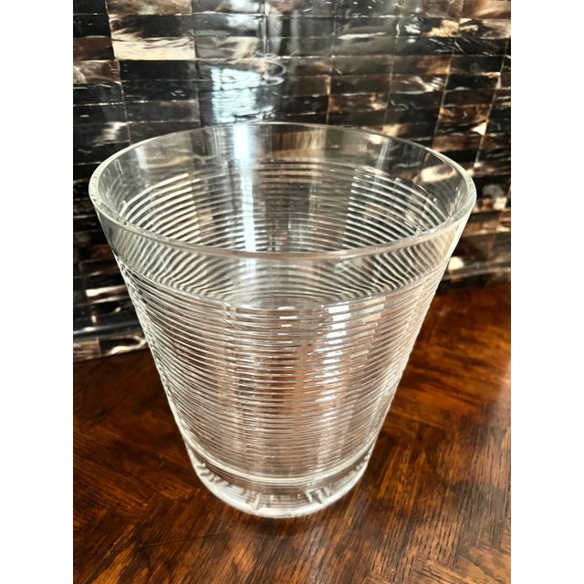 A wonderful ice bucket or champagne bucket of ribbed glass and a start feature on the bottom. A compliment to any bar,...
