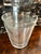 A wonderful ice bucket or champagne bucket of ribbed glass and a start feature on the bottom. A compliment to any bar,...