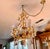 1950s Florentine Hand Gilt 6 Light Vintage Toleware Chandelier With Shades, Crystals and Floral Glass Drops For Sale In Los Angeles - Image 6 of 8