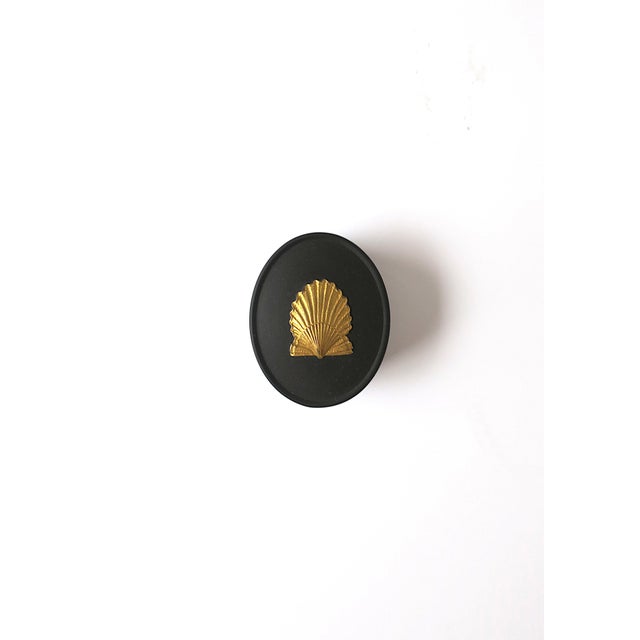 A beautiful special edition English Wedgwood black basalt Jasperware small oval box with gold scallop seashell design,...