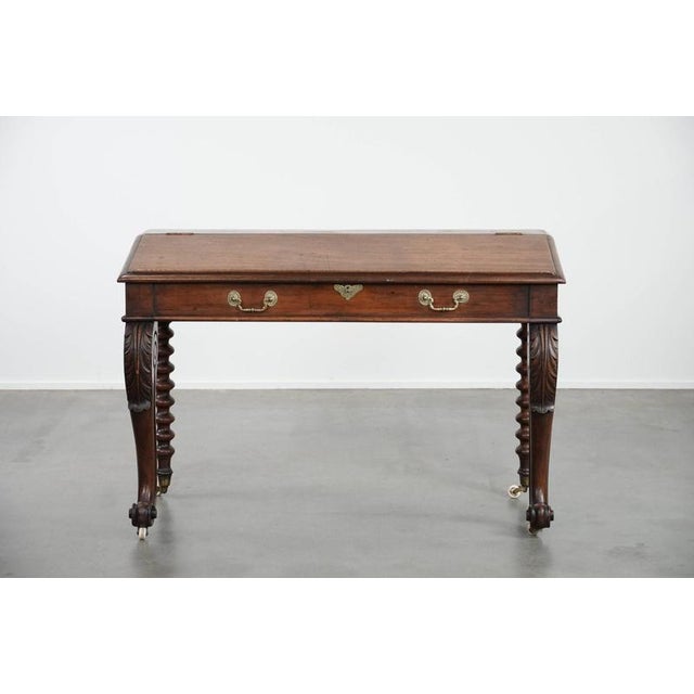 This beautiful antique writing table originates from 19th-century England. It is gracefully and elegantly designed, with...