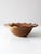 This vintage handcrafted ceramic bowl, signed by the artist, features a two-tone brown and tan glaze and a ruffled edge. A...