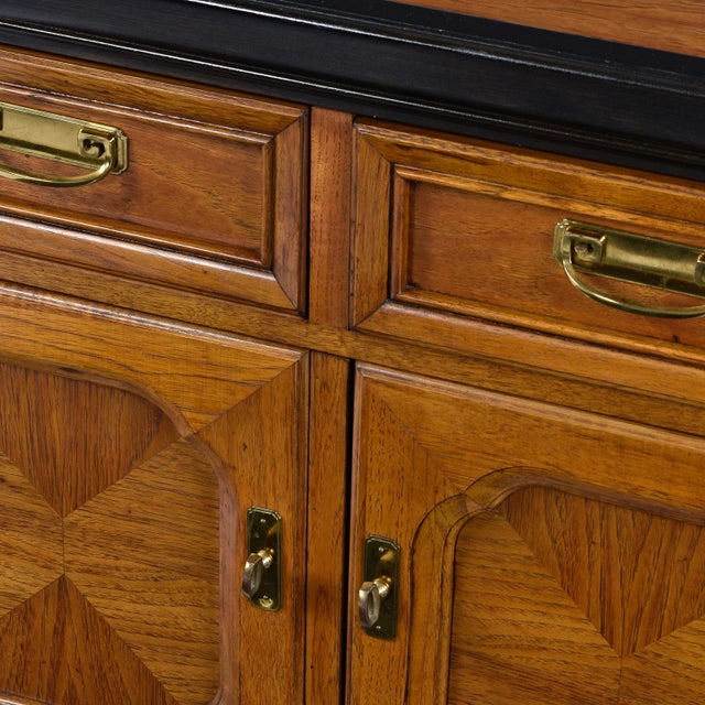 Dorothy Draper style campaign credenza made by esteemed US furniture maker Thomasville circa 1970s. Old growth flaxen...