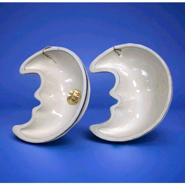 This listing is for a matched pair of vintage Italian ceramic moon faces. One piece still retains the original gold ABC...