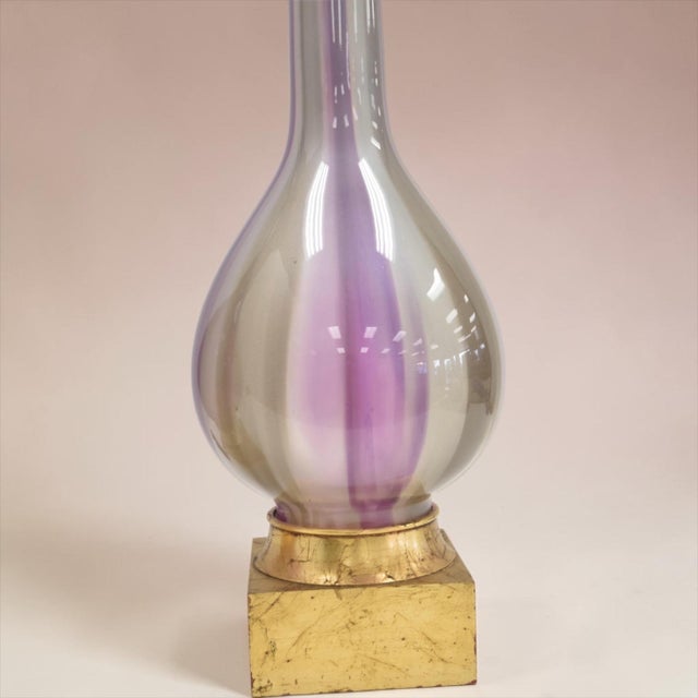 These are amazing! This is an exceptional pair or mid-century Italian art glass table lamps executing the traditional...