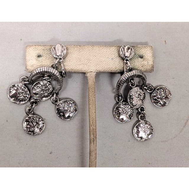 Trifari Vintage 1970s Signed Crown Trifari Rhodium Plated Alexander the Great "Coin" Chandelier Clip Earrings-2 Pieces For Sale - Image 4 of 8
