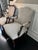 Offered is a pair of coordinating armchairs with a blue/gray upholstery. This set is unmarked as the upholstery is not...