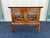 Mid-century walnut nightstand or side table with heavy Asian influence and chinoiserie stylized elements. Imitating a...