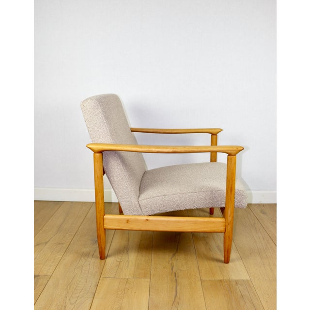 GFM-142 armchair designed by Edmund Homa from the 1970s, upholstered in beige boucle fabric. Two pieces available....