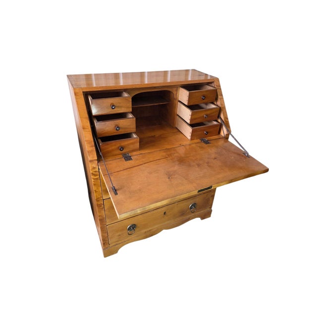 This elegant Biedermeier secretary dates from around 1820. It is distinguished by its beautiful veneer of warm cherry...