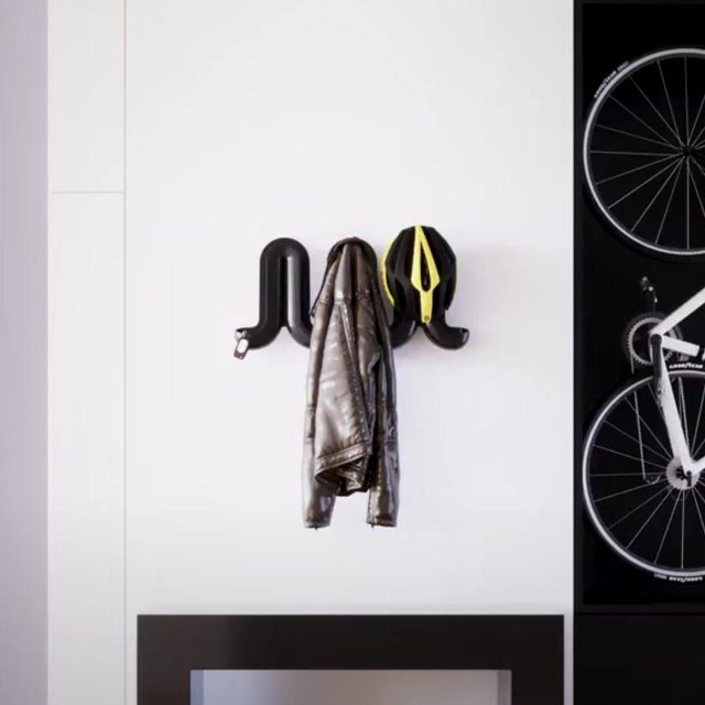 Transform your home’s entrance into a fun and multi-functional space with the whimsical wave-like Heller® Swell™ wall-...