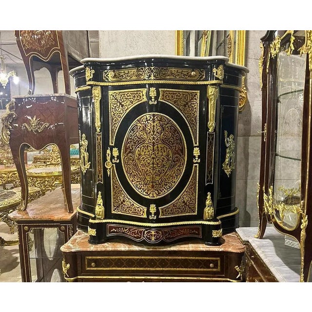Magnificent French marquetry commode with marble inlays Louis XV style. The design on the door is sublime, all the wooden...