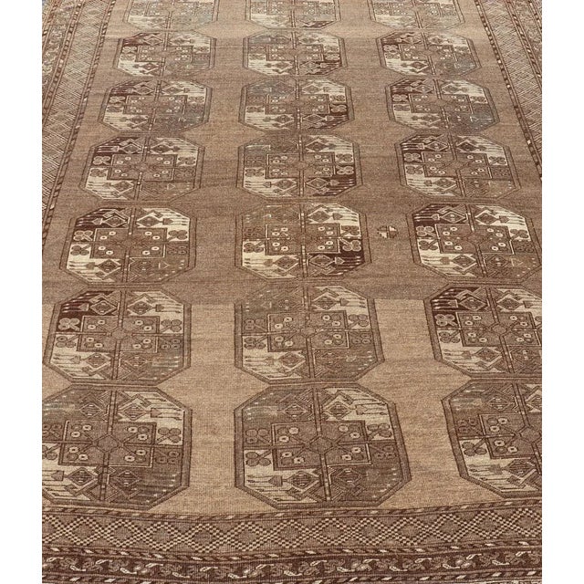 This Ersari rug has been hand-knotted in the finest wool. The rug features a sub-geometric repeating Gul design throughout...