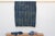 A masterwork of Malian textile heritage featuring deep indigo saturation and symbolic geometric motifs. Originating from...