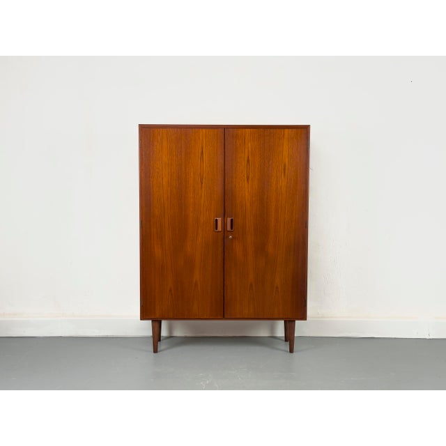Timeless reddish-brown teak cabinet designed by B. Mogensen for Søborg Møbelfabrik. High-quality construction with two...