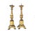 A Pair of Italian Carved and Gilded Candlesticks that embody the elegance of classical design. Each candlestick rises from...