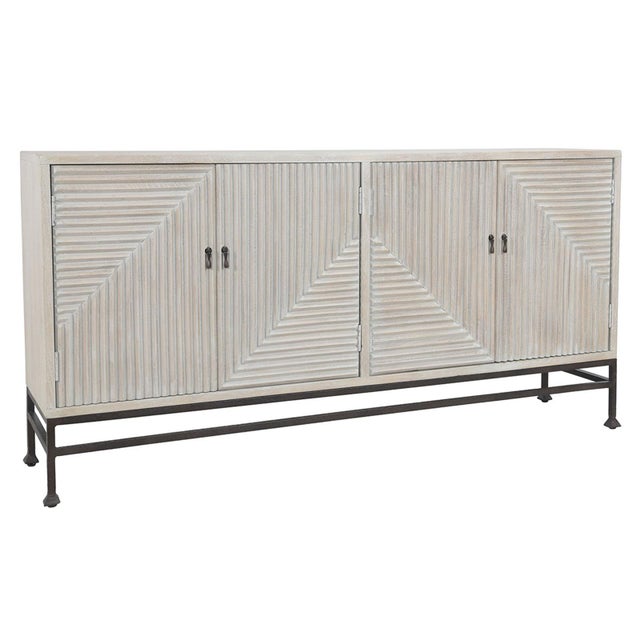 White wash mango wood sideboard with geometric modern carved lines design pattern on four doors. Iron frame and pulls....