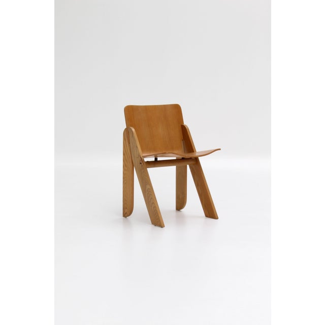 These chairs embody the understated strength of 1970s Italian design: a solid wood frame with angular lines supporting a...