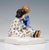 Very rare meissen art nouveau porcelain group: a boy sitting on the floor with his legs stretched out, wearing a blue-...