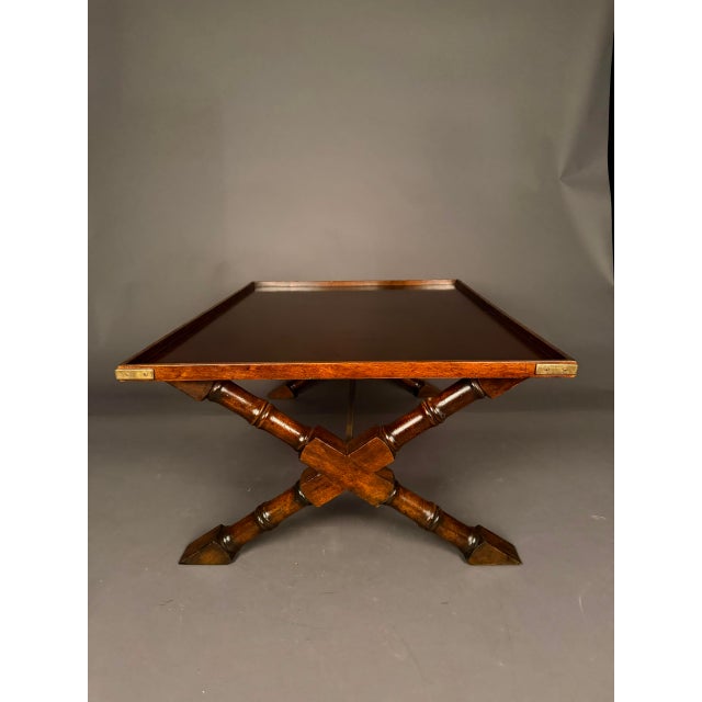 Bring classic campaign-inspired style to a living room, library, or study with this vintage mahogany coffee table, circa...