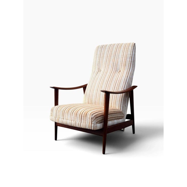 Here is a mid-century modern "Combi Star" rocking recliner lounge chair, designed by Norwegian designer Arnt Lande for...