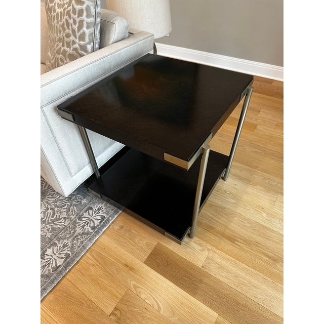Modern Theodore Alexandre dark wood and chrome side table. Model No.5005-932. Chrome accent side rails and black stained...