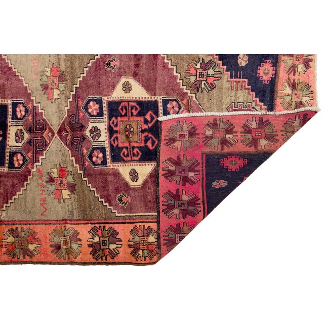 This authentic Vintage Meysar Persian Runner features a striking triple-medallion design set against a warm, earthy taupe...