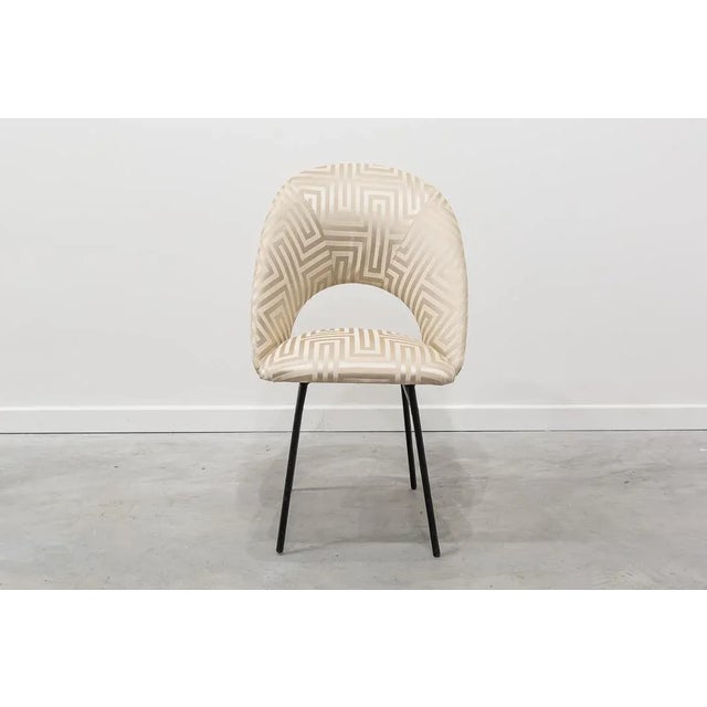 Chair iron structure chair with geometric fabric.