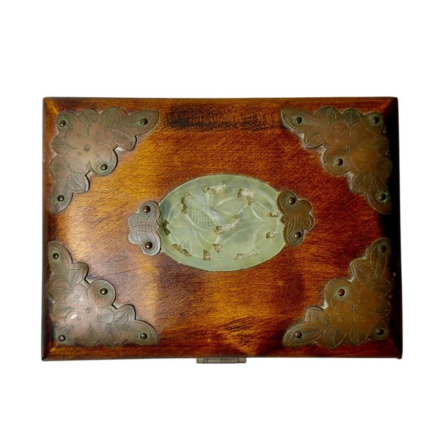 A charming early 20th century Chinese strongbox, crafted in rich rosewood and accented with intricate brass straps and...