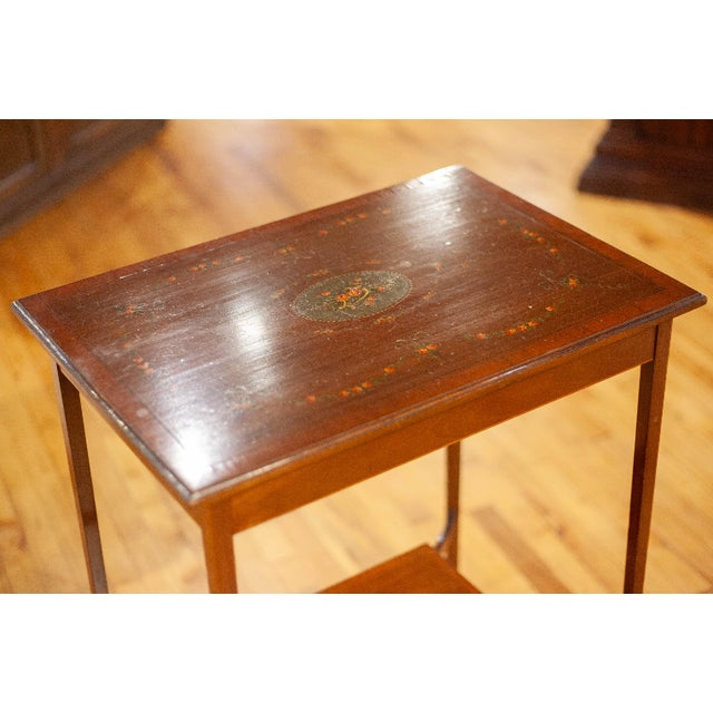 Edwardian side table with hand painted floral swags and center medallion. Circa: 1880