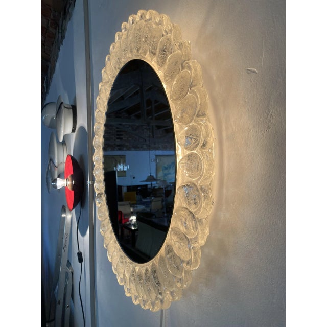 Large wall mounted mirror, back-lit, 63cm diameter, in the style of Hillebrand